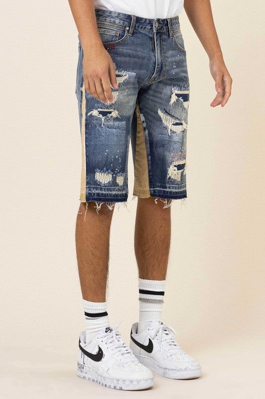 MULTI CAMO PANELED RELEASED HEM DENIM SHORTS