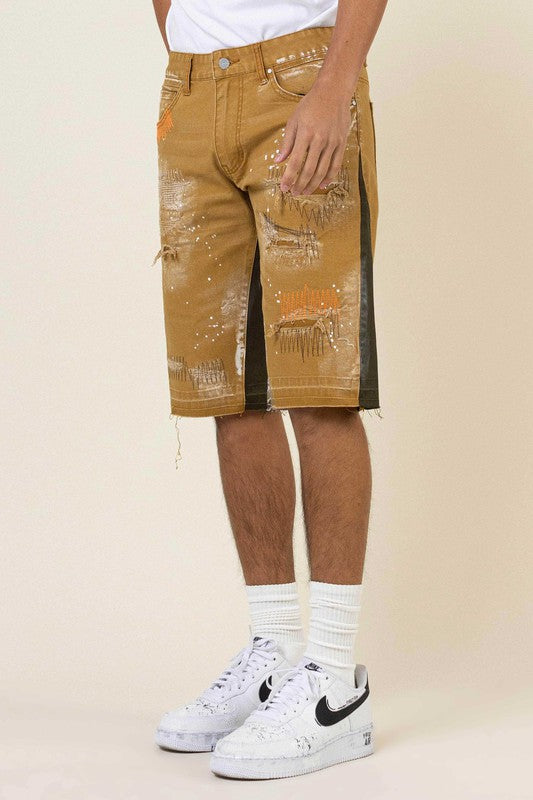 MULTI CAMO PANELED RELEASED HEM DENIM SHORTS