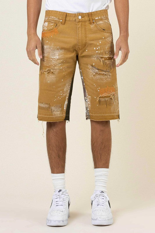 MULTI CAMO PANELED RELEASED HEM DENIM SHORTS