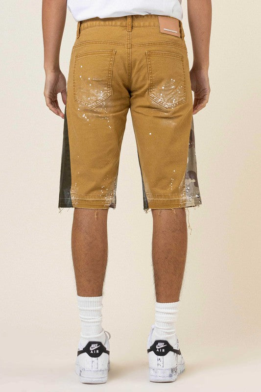 MULTI CAMO PANELED RELEASED HEM DENIM SHORTS