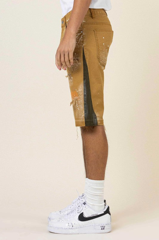 MULTI CAMO PANELED RELEASED HEM DENIM SHORTS