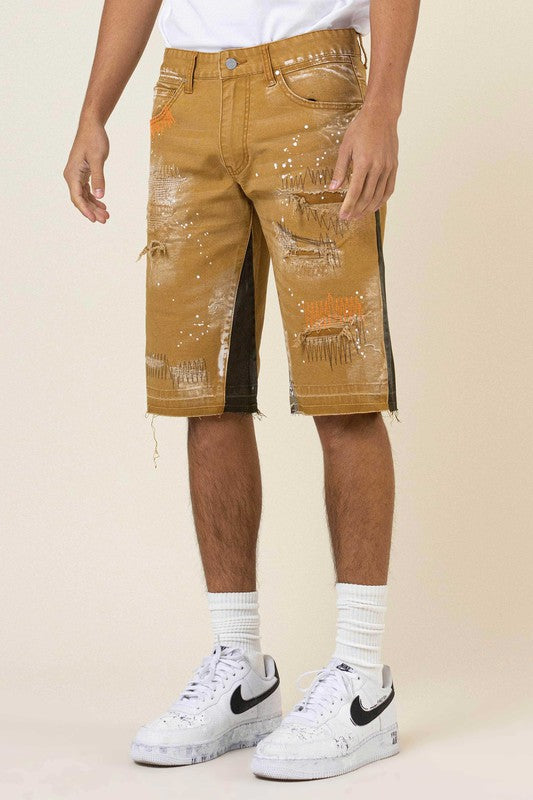 MULTI CAMO PANELED RELEASED HEM DENIM SHORTS